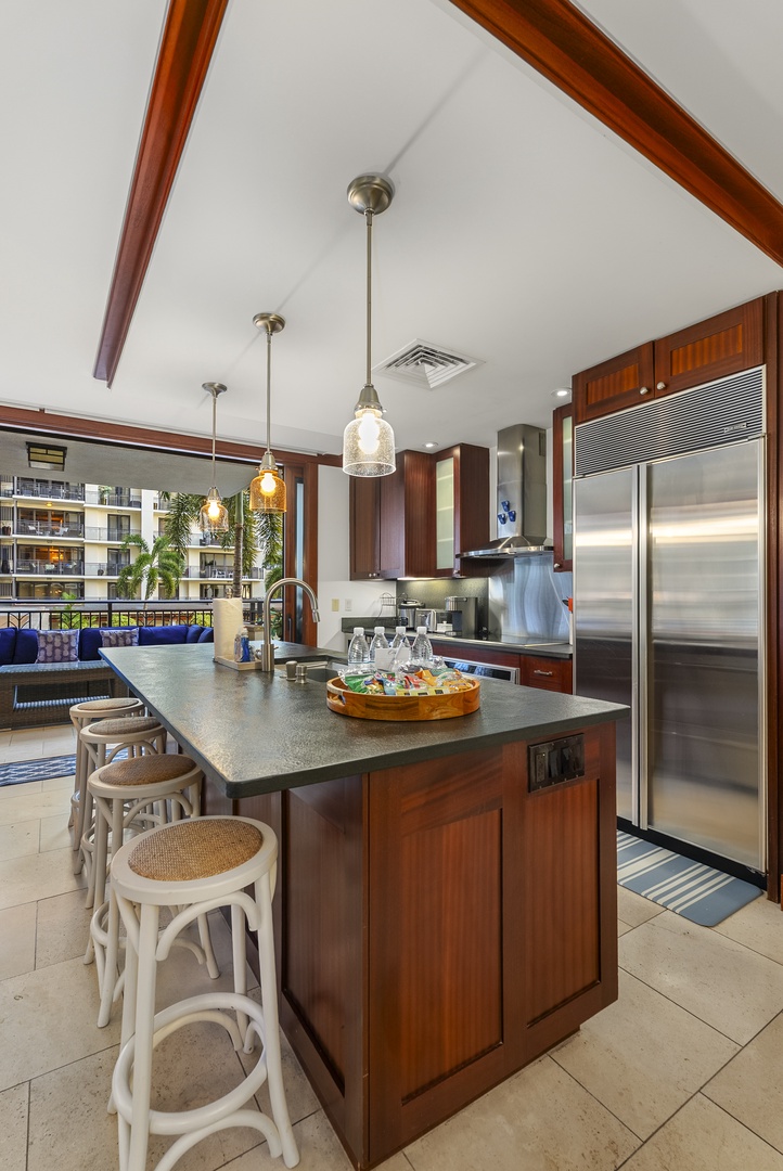 Kapolei Vacation Rentals, Ko Olina Beach Villas O211 - The long island draws everyone in before dinner, stools set and waiting.
