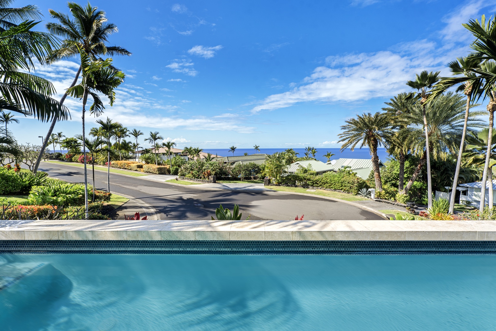 Kailua Kona Vacation Rentals, Ohana le'ale'a - Take a refreshing dip in the pool while soaking in stunning ocean views.