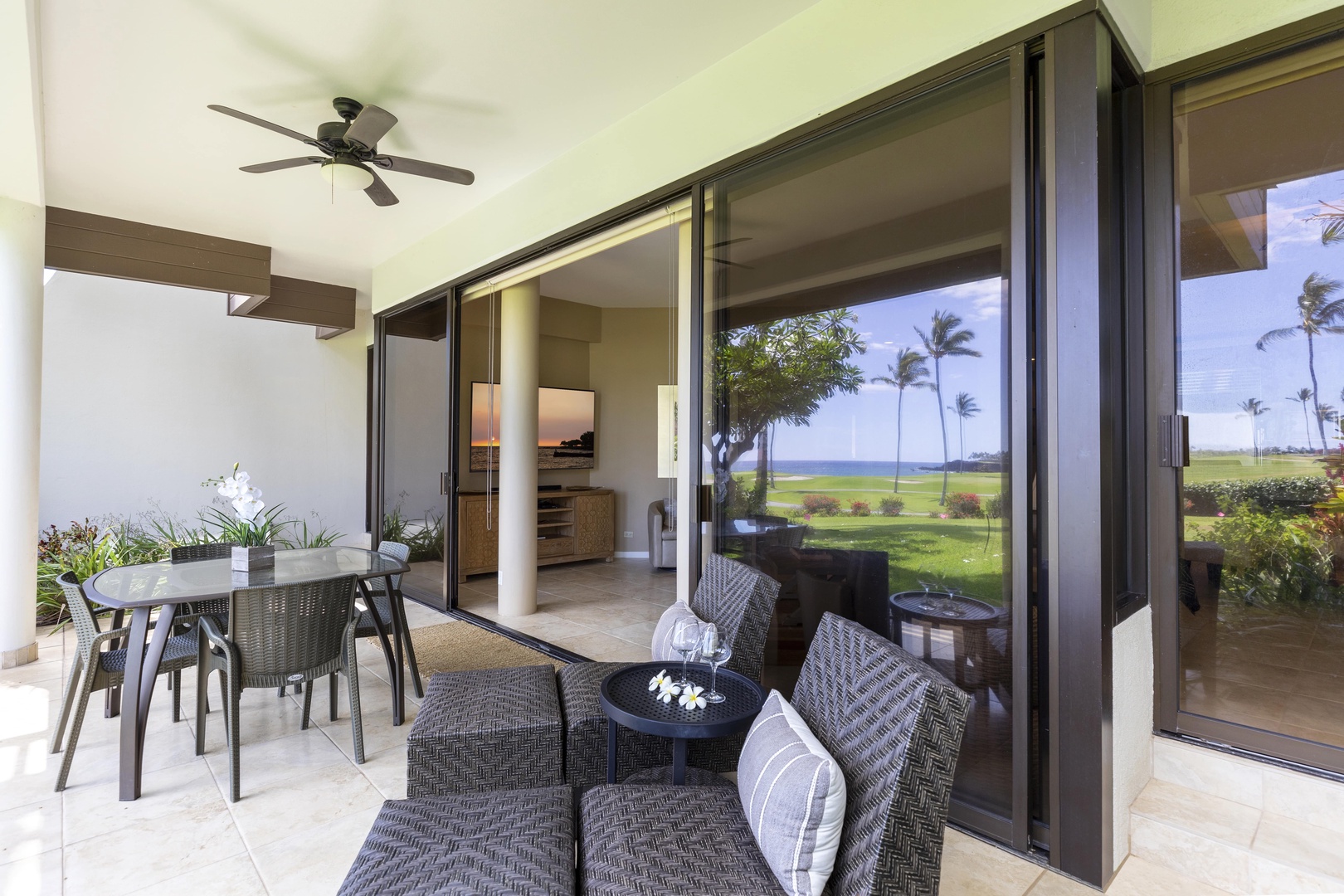 Kamuela Vacation Rentals, Mauna Lani Point E105 - Read a book or take in the beauty from the lounge chairs on the lanai.