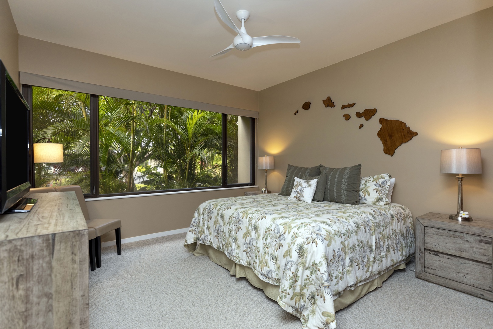 Kamuela Vacation Rentals, Mauna Lani Point E105 - The guest suite is nestled in a serene tropical setting, perfect for peaceful mornings and restful nights.