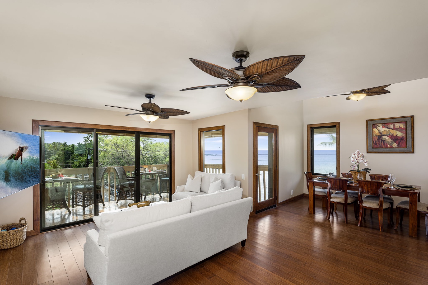 Kailua Kona Vacation Rentals, Royal Kahili 401A - Spacious living area with white sofas and flowing seamlessly into the dining area.