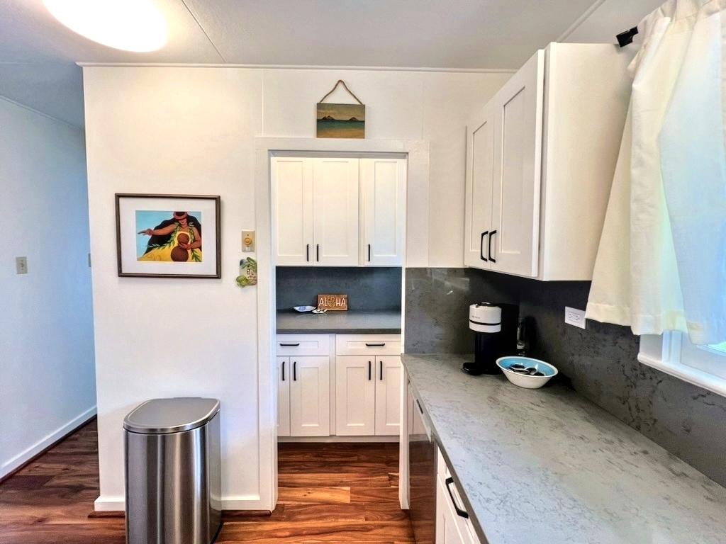 Kailua Vacation Rentals, Lanikai Cottage - A stylish kitchen with sleek cabinetry and fresh finishes, making meal prep a breeze during your stay.