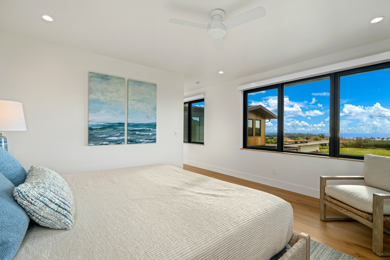 Koloa Vacation Rentals, Hale Laule'a at Kukui'ula - Wake up to stunning panoramic views from your bright, airy bedroom with coastal artwork creating the perfect serene retreat.