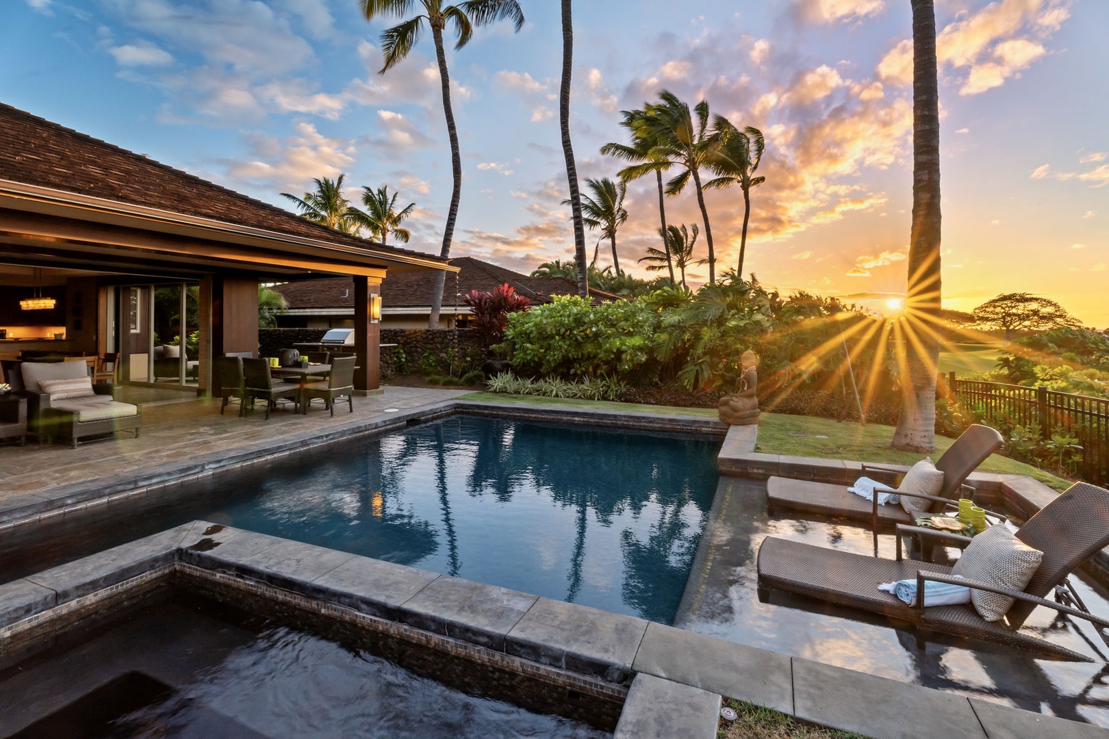 Kailua Kona Vacation Rentals, 3BD Pakui Street Estate (149) at Hualalai Resort - Aim the loungers at the sunset, the sky going orange behind the palms.
