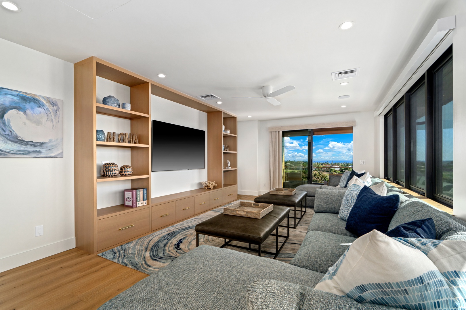 Koloa Vacation Rentals, Hale Laule'a at Kukui'ula - Sink into this stylish living space where your favorite shows come alive on the large TV with breathtaking views from every window.