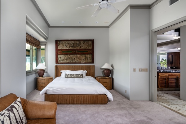 Kamuela Vacation Rentals, Canoe House & Beach Walker at Champion Ridge - Cozy guest bedroom with queen-sized bed, simple décor and natural light, offering a peaceful space for rest.