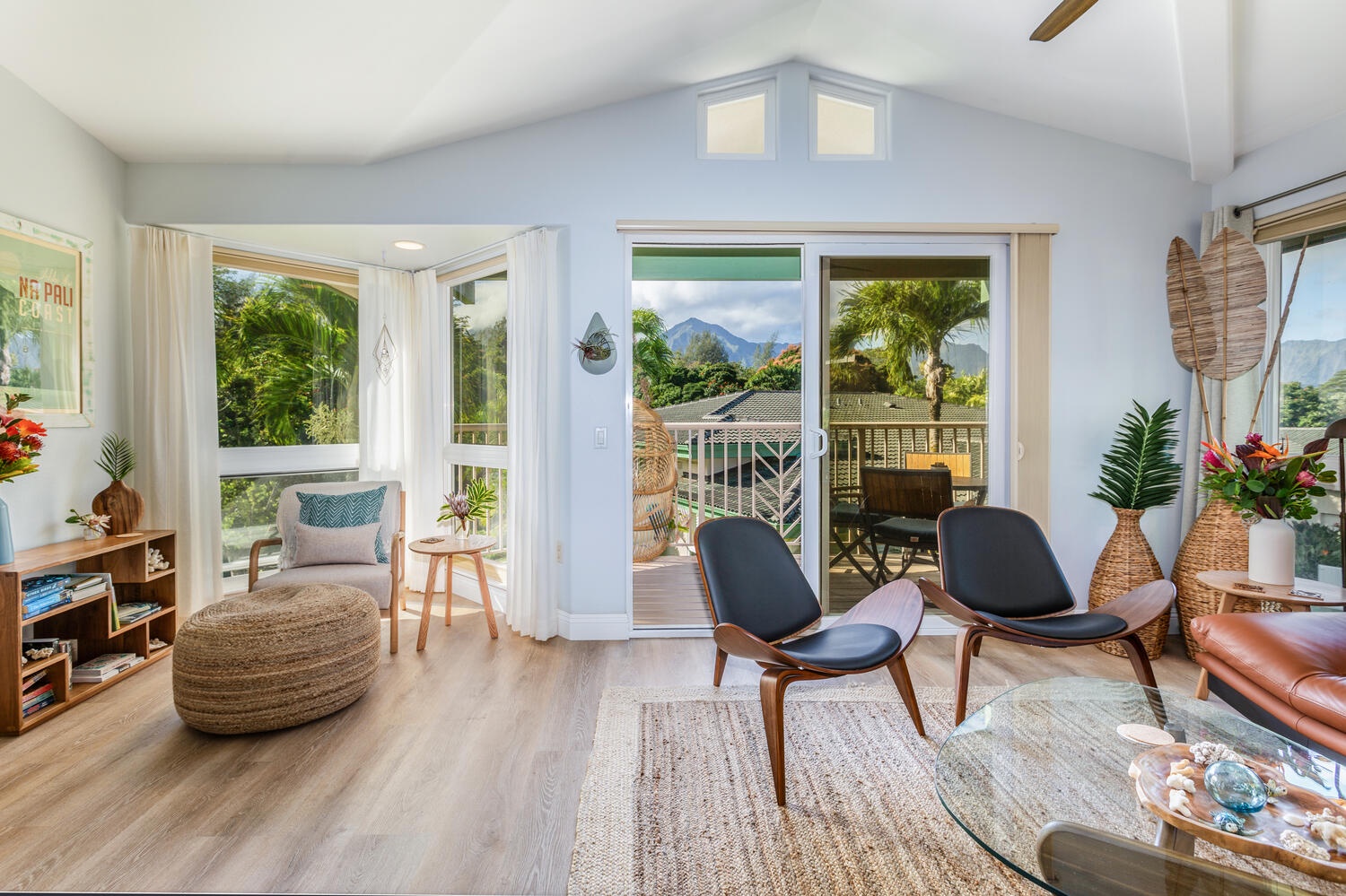 Princeville Vacation Rentals, Sea Glass - A chic and stylish living area with large windows and glass sliders for a bright and airy ambiance.