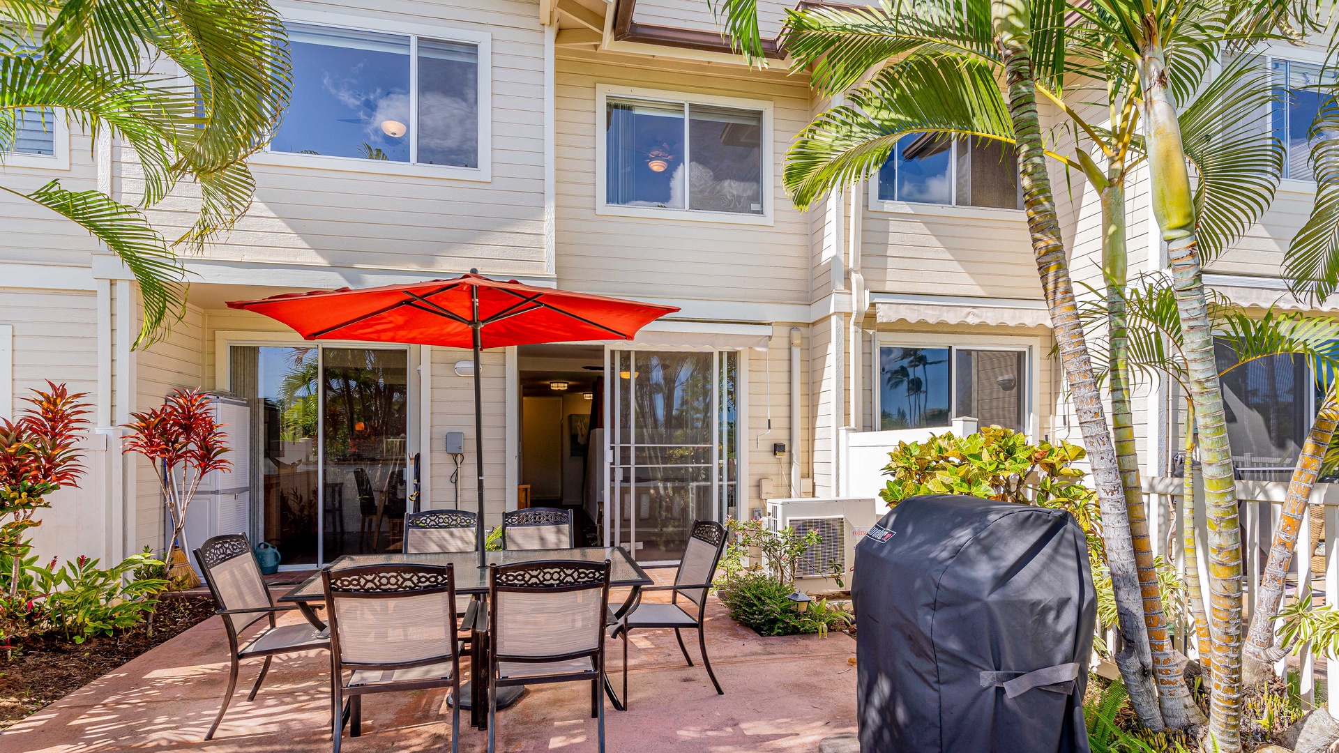 Kapolei Vacation Rentals, Fairways at Ko Olina 20G - A view outside of this charming stay under sun dappled palms.