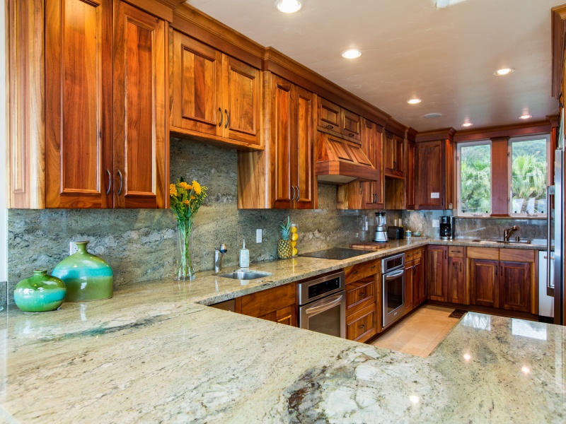 Haleiwa Vacation Rentals, Pipeline House (Oahu KC) - Spacious open kitchen with granite counter tops and koa wood cabinetry. Perfect for entertaining!