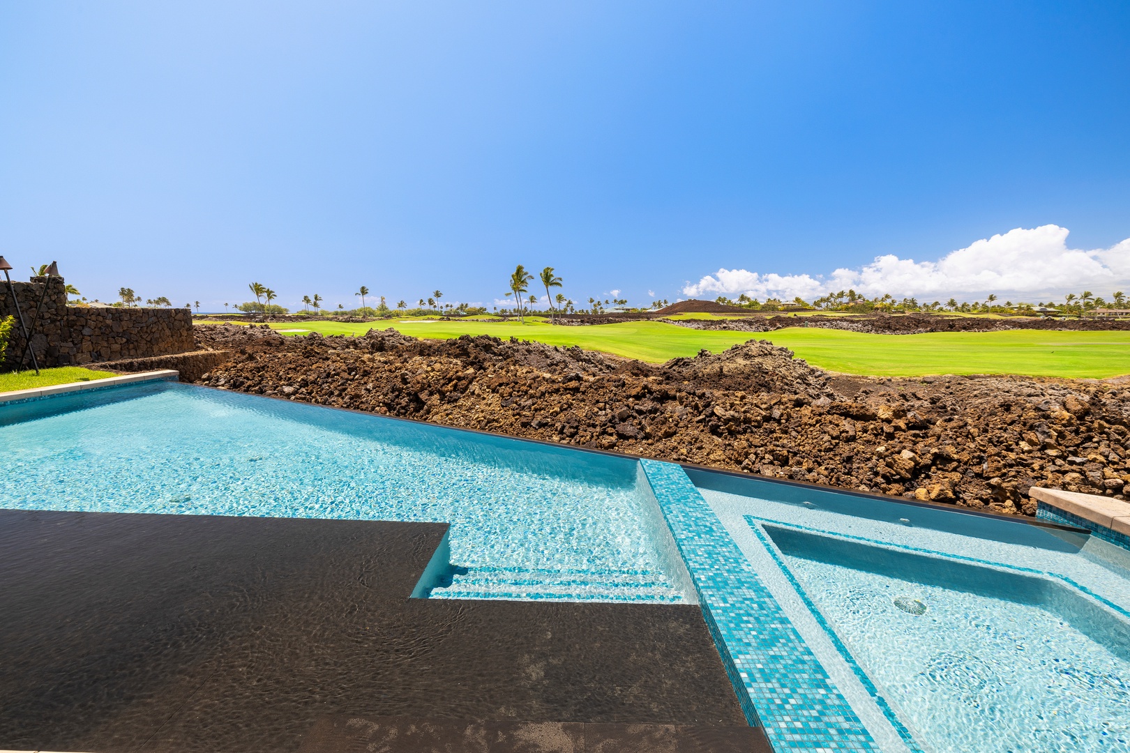 Kamuela Vacation Rentals, 6BD Mauna Lani Lux Golf Estate (5) at One Ocean - The infinity-edge pool seemingly spills toward the greens, creating an uninterrupted connection with the landscape.