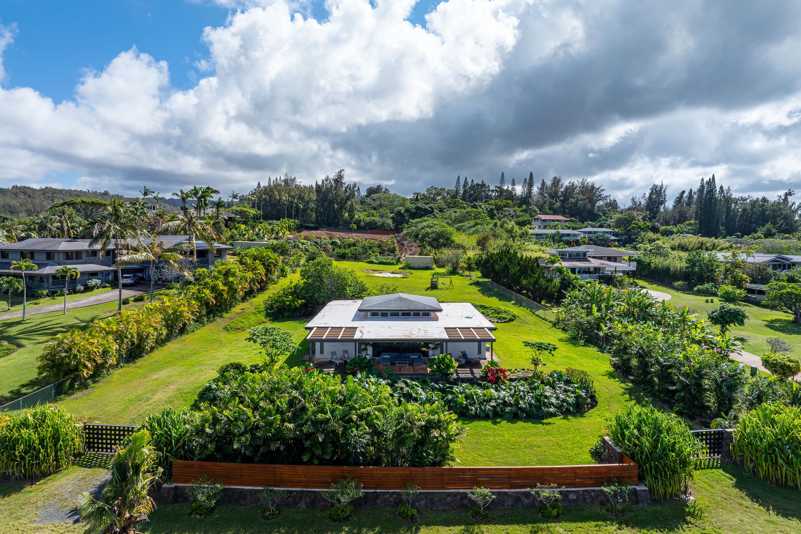 Haleiwa Vacation Rentals, Hale Mahina - Admire the expansive grounds with manicured landscaping and a private hillside position.