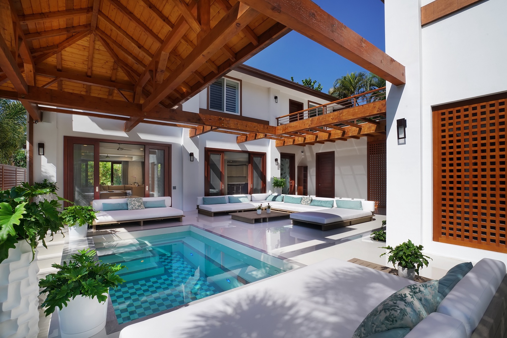 Honolulu Vacation Rentals, Diamond Head Villa* - Jacuzzi and pool surrounded by luxury seating and warm wood accents—relaxation redefined.