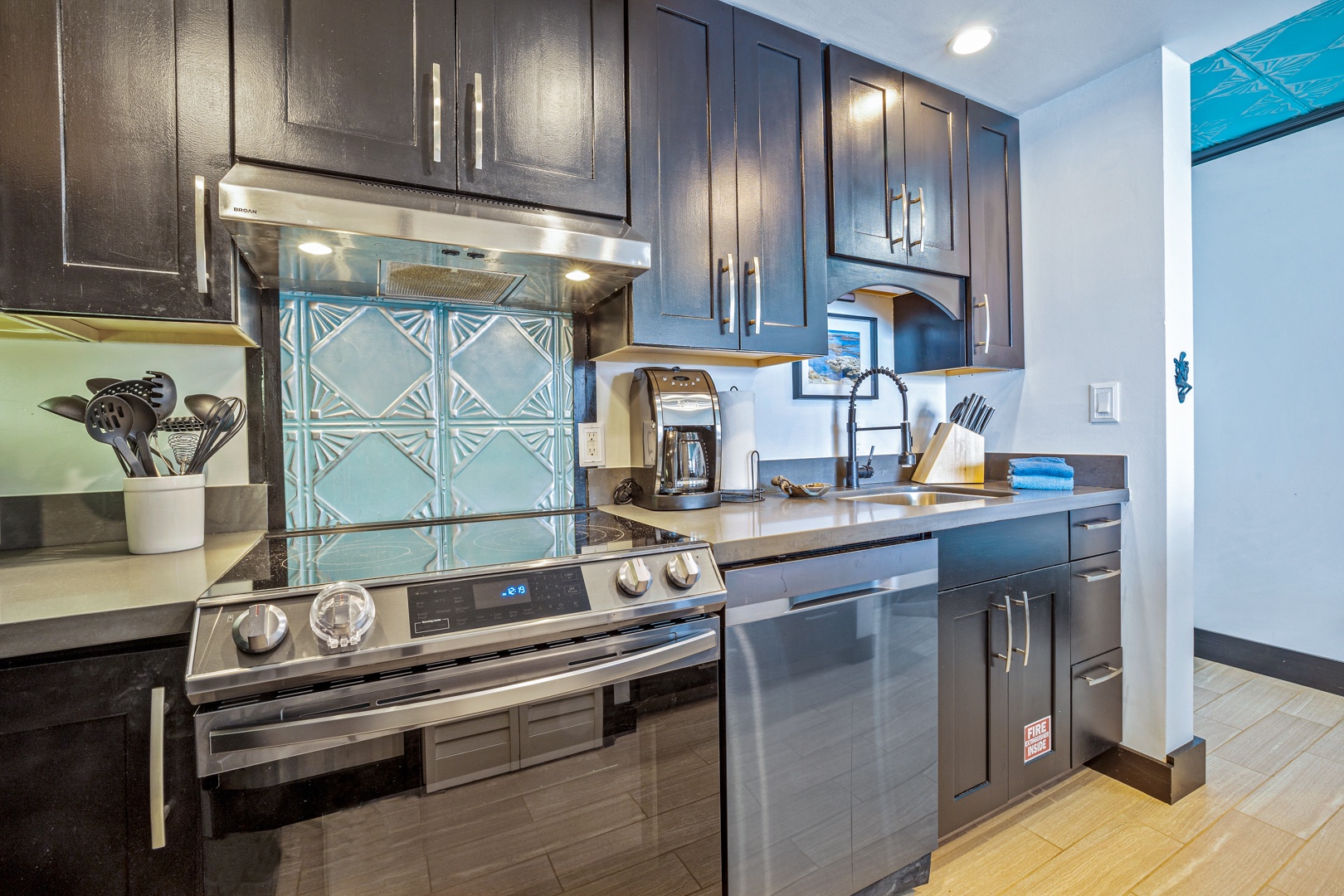 Lahaina Vacation Rentals, Valley Isle 804 - The fully equipped kitchen features elegant cabinetry, modern appliances, and a stylish backsplash, making it a beautiful and functional space to cook and entertain.