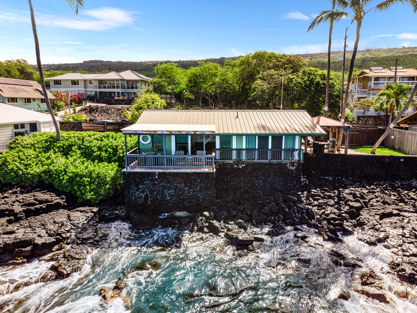 Kailua Kona Vacation Rentals, The Cottage - Take in the unbeatable oceanfront setting, with waves crashing below and lush greenery surrounding your private escape.