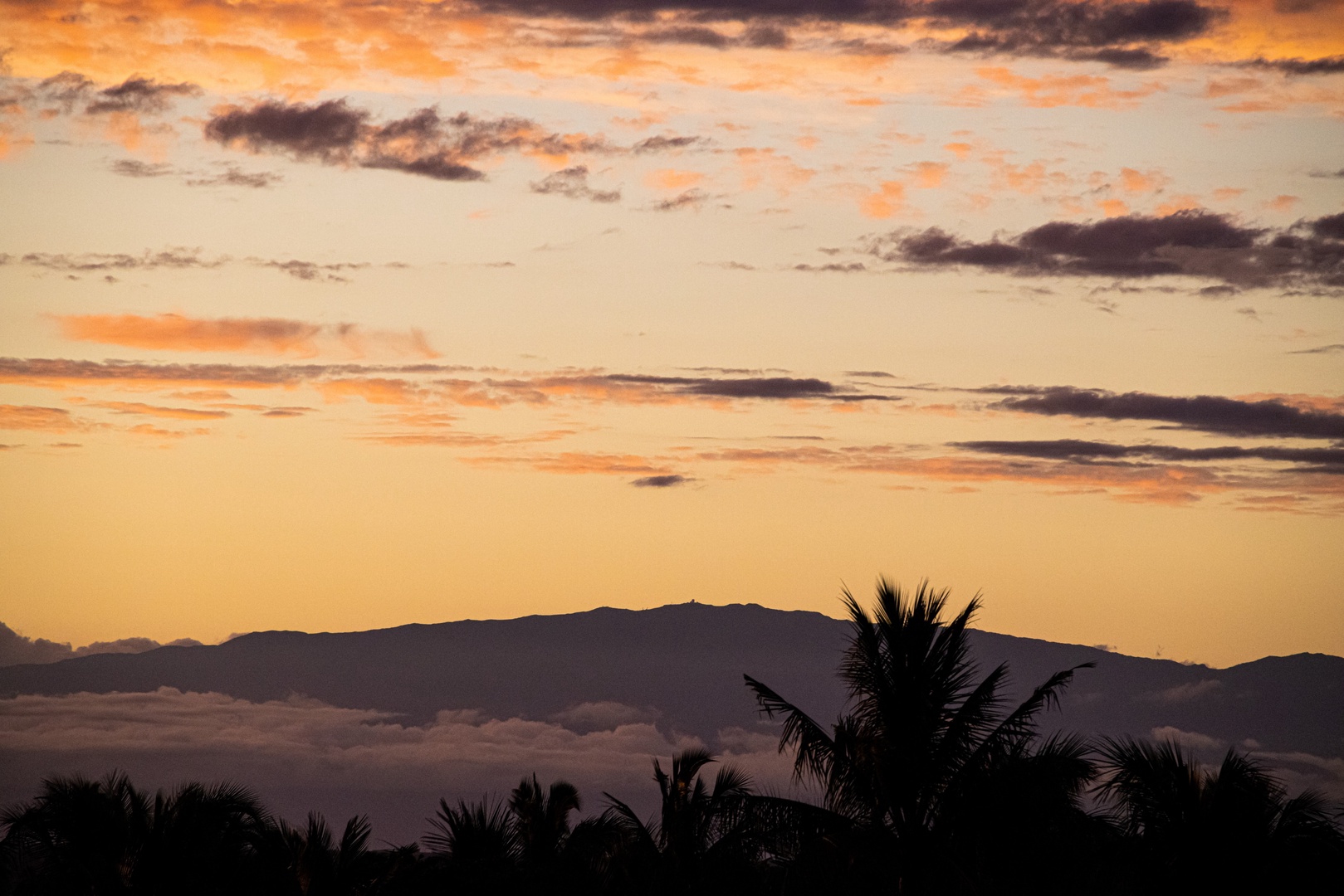 Kamuela Vacation Rentals, Champion Ridge 7 - Golden hour silhouettes the mountains of the Big Island in a peaceful glow.