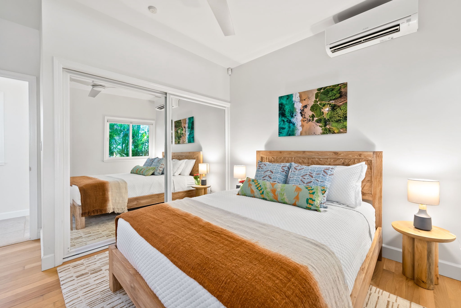 Kailua Vacation Rentals, Kailua Beach House - Comfy guest bedroom with king bed, A/C, and a peaceful tropical view.