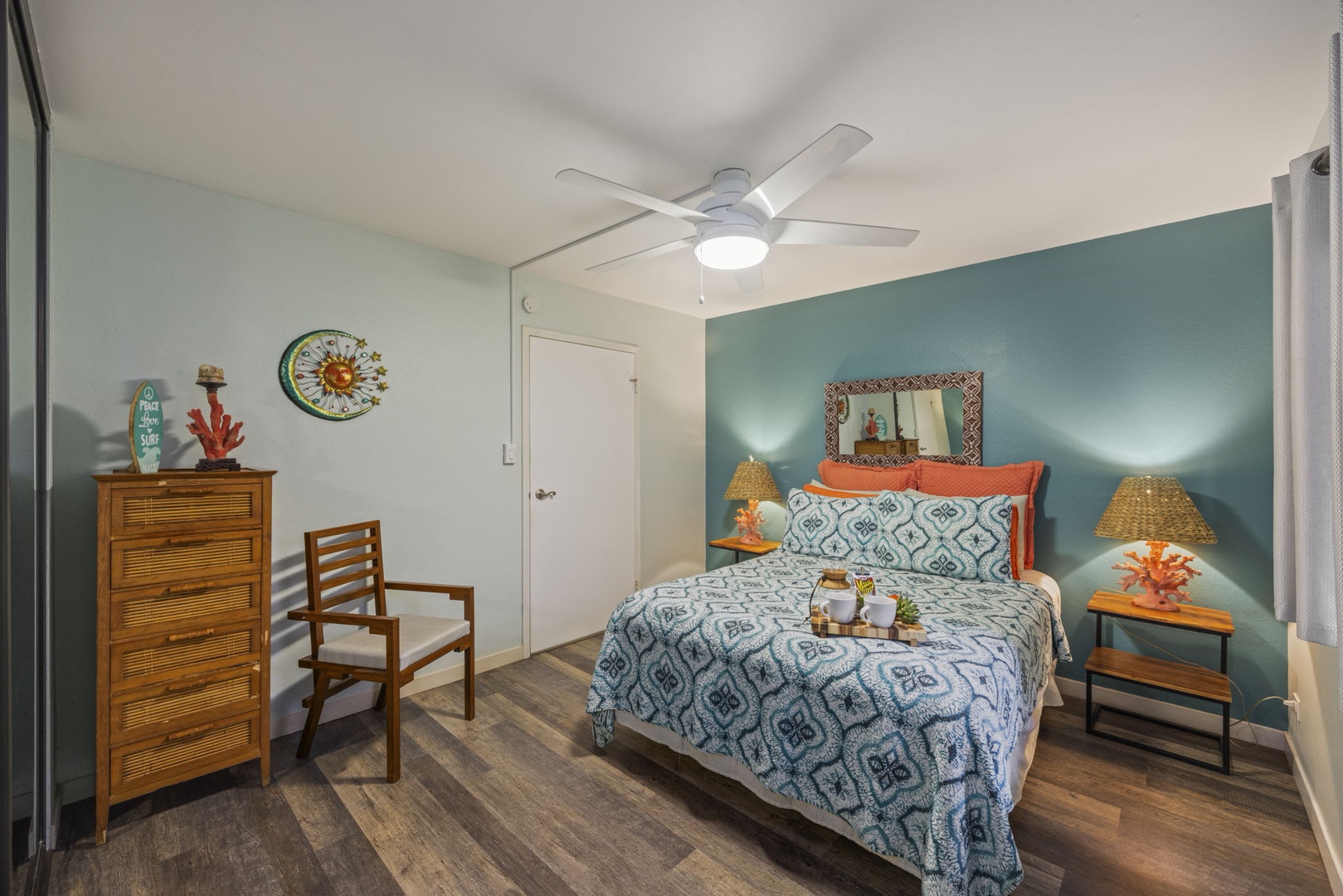 Kihei Vacation Rentals, Kihei Alii Kai C206 - Close the bedroom door on the day, bed against the teal wall, a lamp on each side.