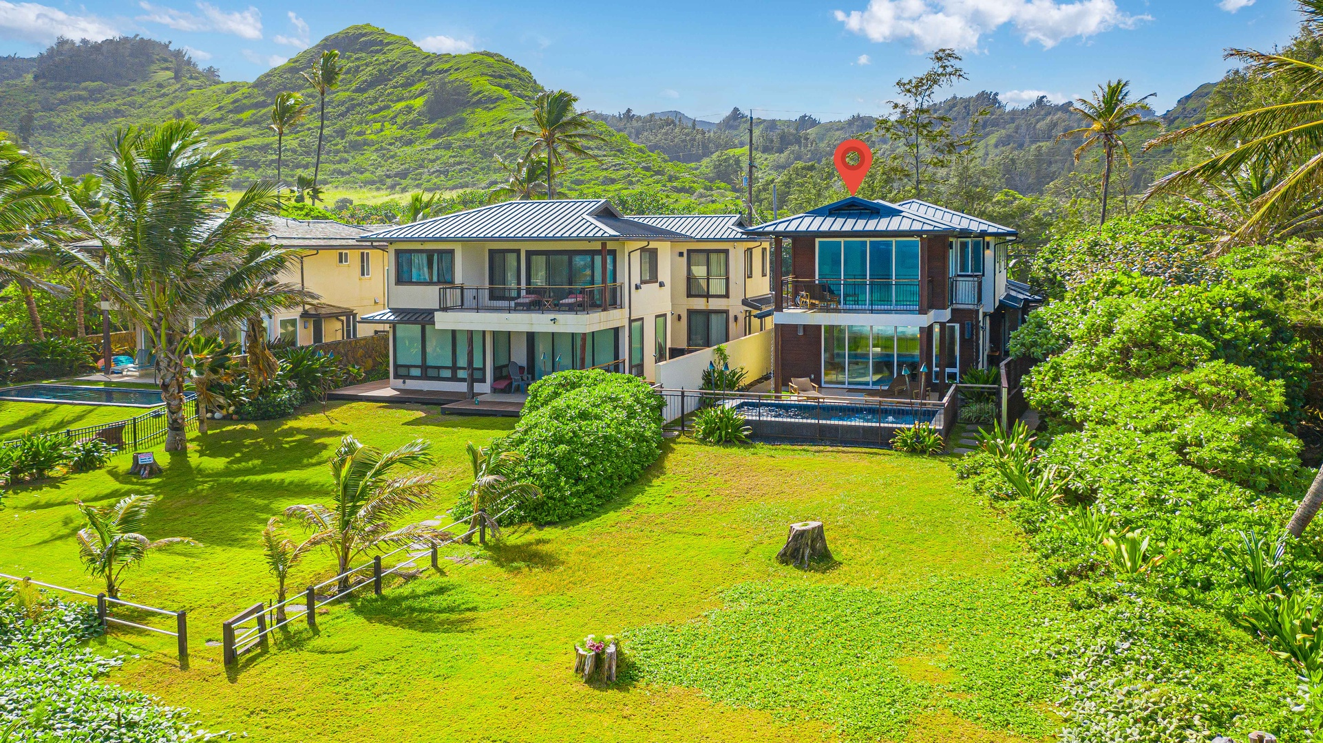 Laie Vacation Rentals, Majestic Mahakea Oceanfront Oasis - Expansive lawn leading to the property, with stunning mountain and ocean views.