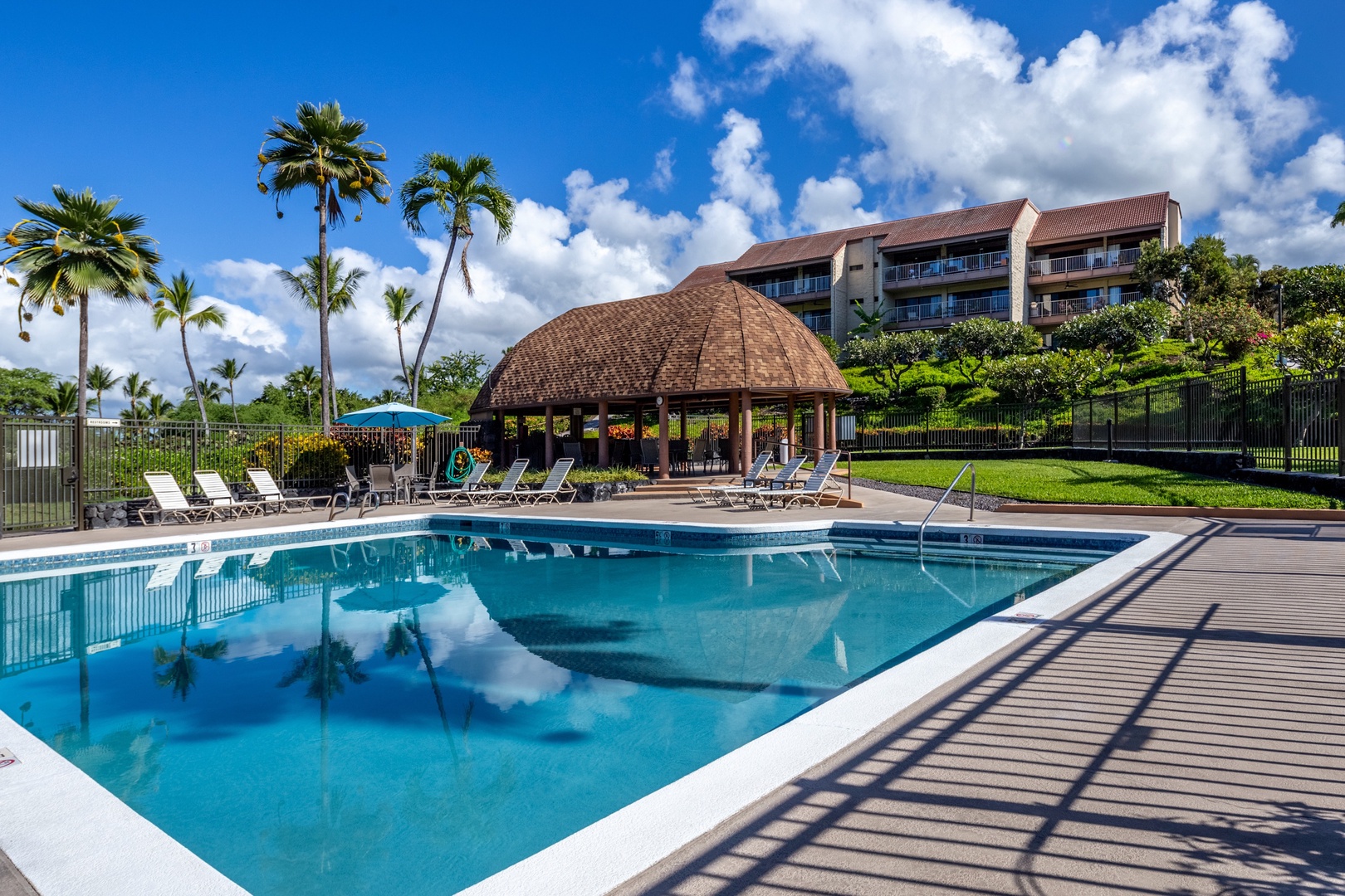 Kailua Kona Vacation Rentals, Keauhou Kai C301 - Claim a lounger at the pool for an early morning soak, whether it's in the water or the sun.