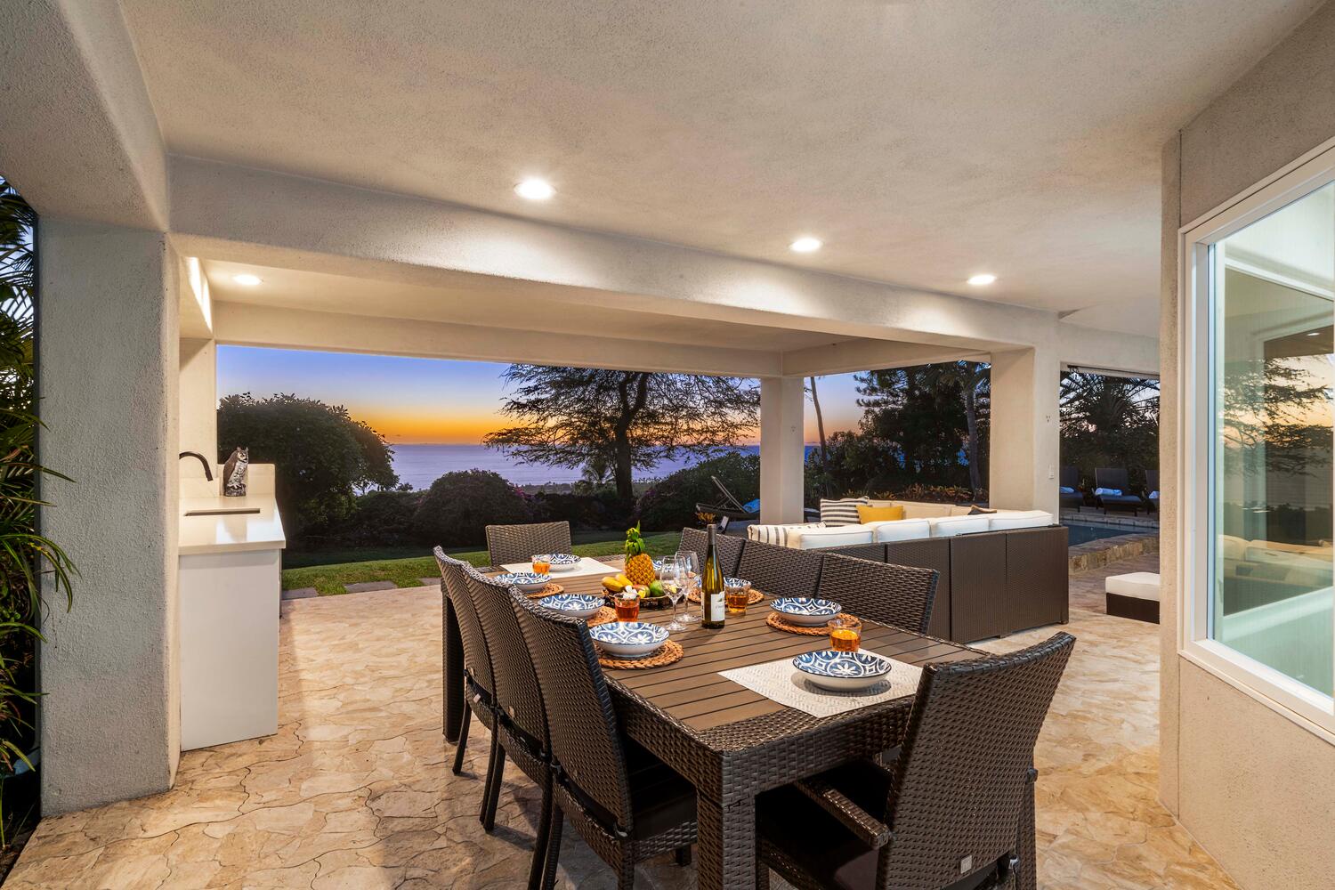 Kailua Kona Vacation Rentals, Ho'okipa Hale - Dine al fresco at the lanai table while enjoying panoramic twilight views and tropical breezes.
