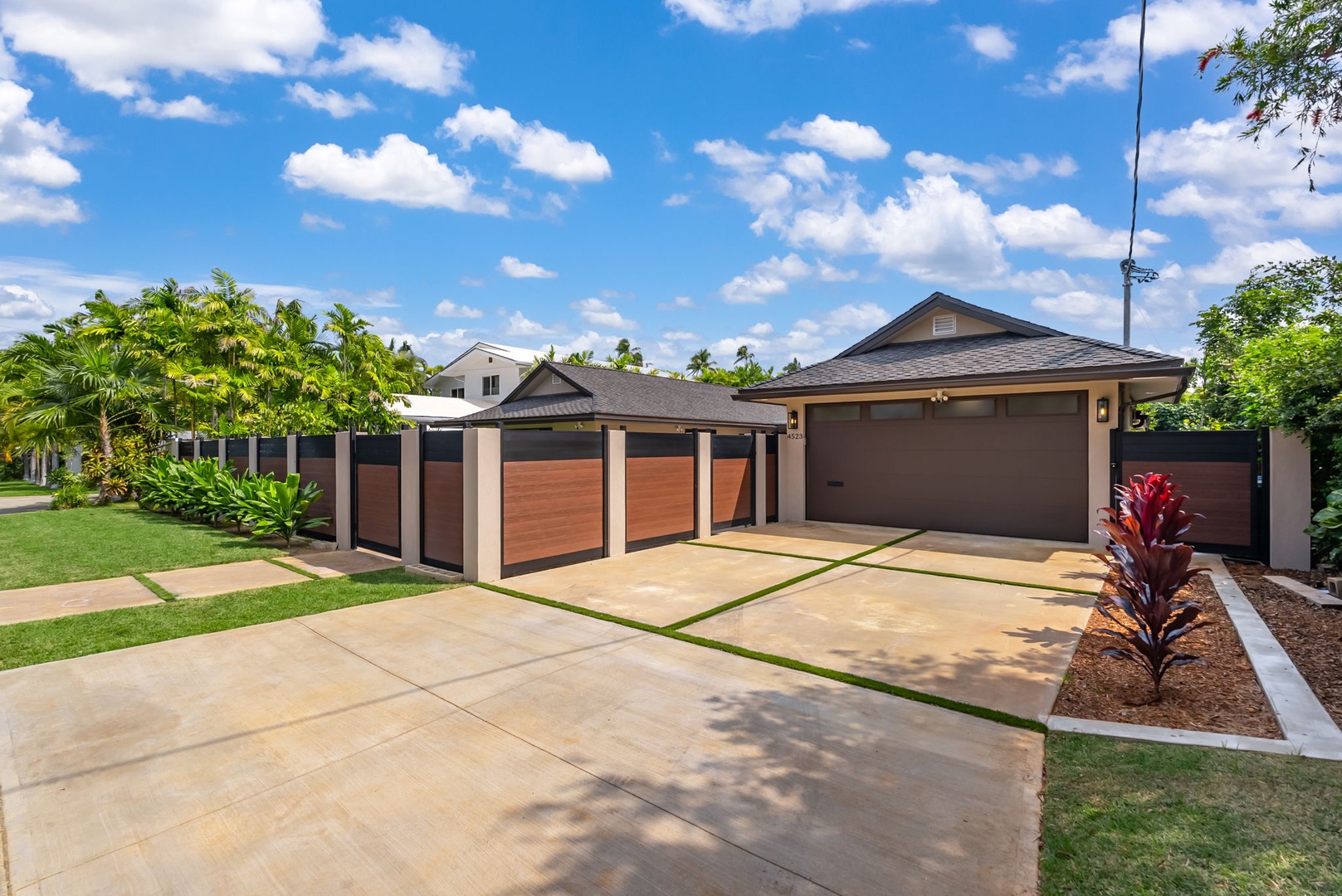 Honolulu Vacation Rentals, Kahala Zen - A spacious driveway leading to a contemporary home with sleek finishes.