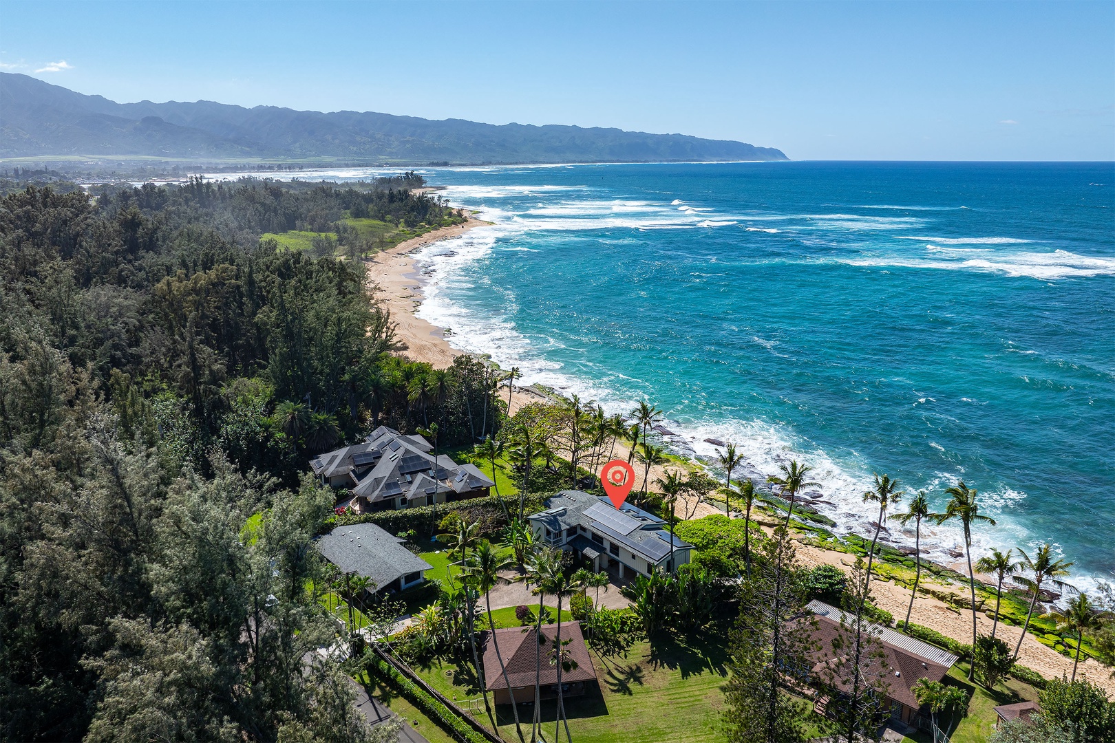 Haleiwa Vacation Rentals, Maluhia Beach House - At the end of a dead end, nestled next to infamous uninhabited beach front. Kaena Point in the distance.