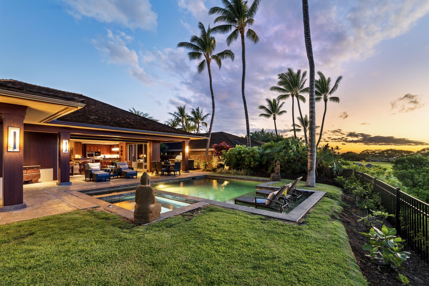 Kailua Kona Vacation Rentals, 3BD Pakui Street Estate (149) at Hualalai Resort - By dusk the house glows and the palms turn to silhouette against the color.