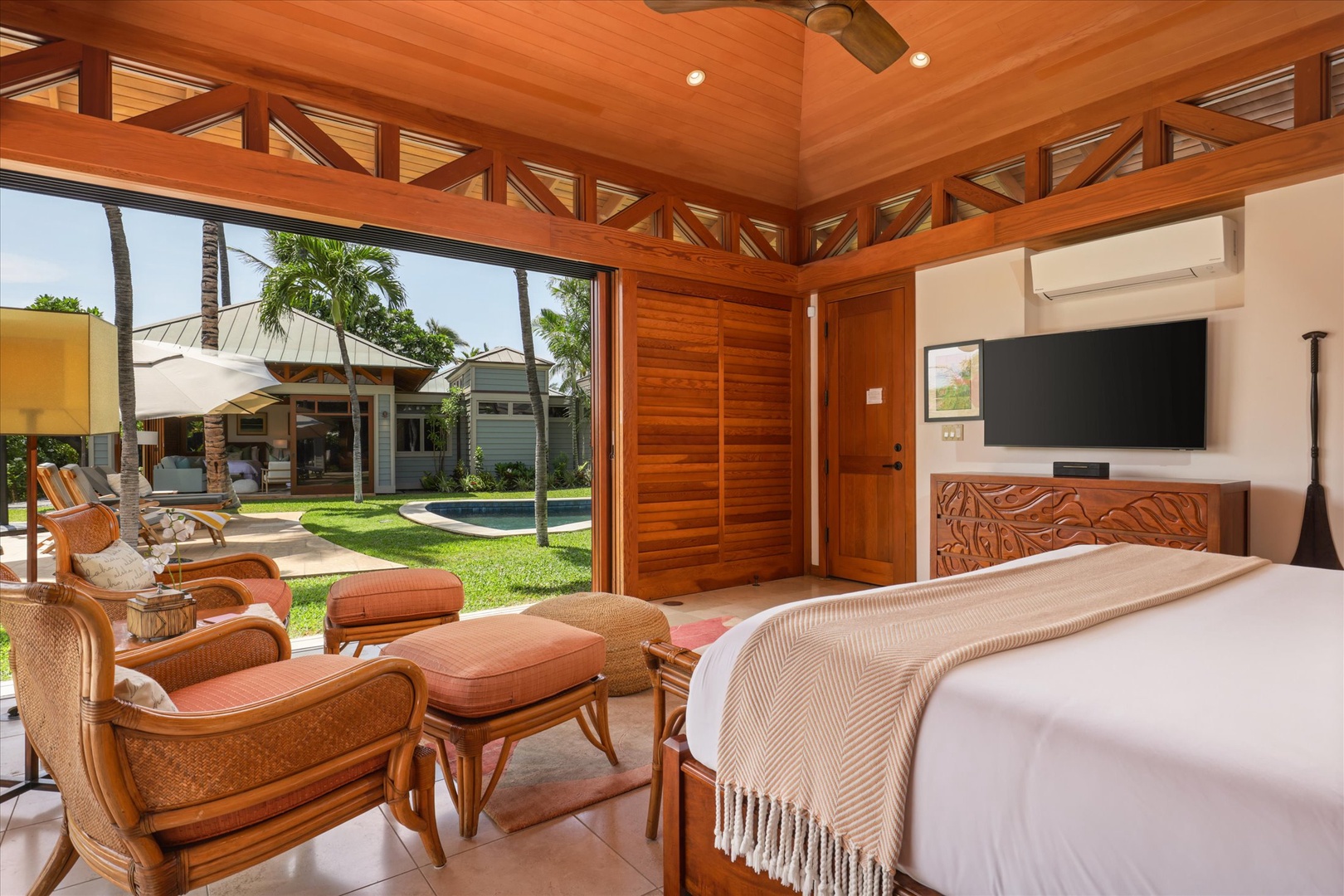 Kamuela Vacation Rentals, 3BD Na Hale 3 at Pauoa Beach Club at Mauna Lani Resort - Roll out of the king bed in the Primary Suite (Bedroom #1) straight onto the lawn through full-height sliders.