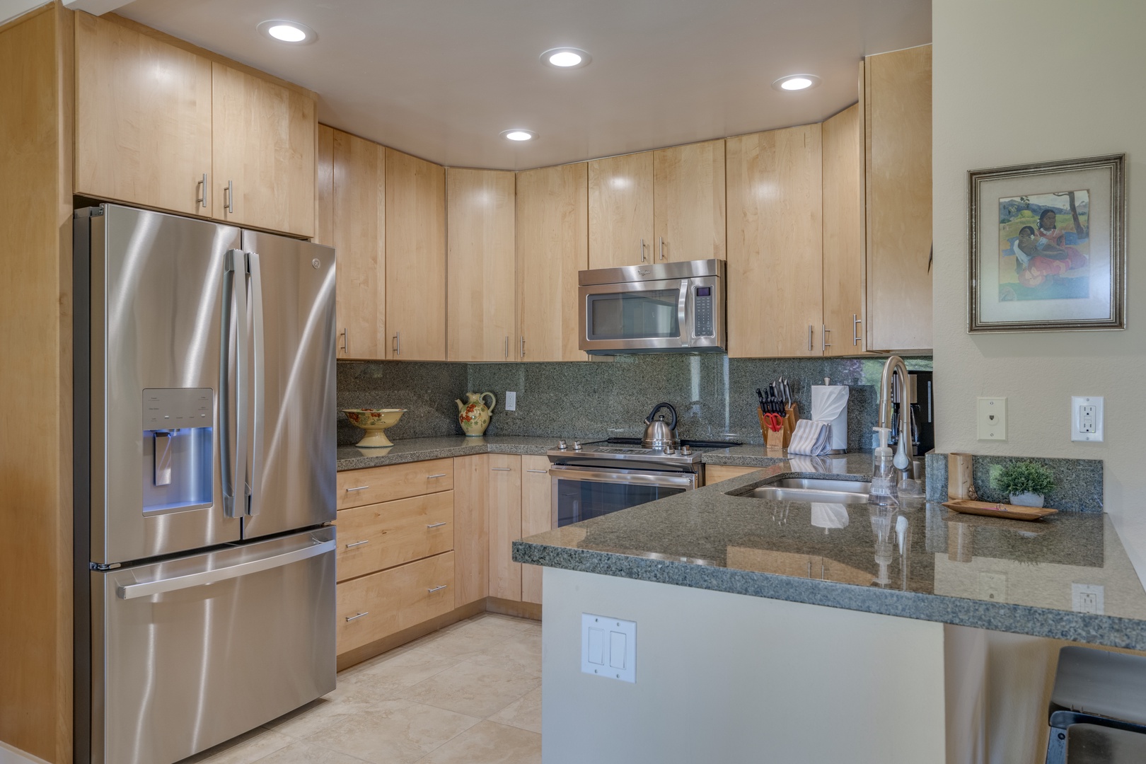 Lahaina Vacation Rentals, Kapalua Golf Villas 14P1-2 - The open kitchen with breakfast bar and adjacent dining space makes entertaining effortless.