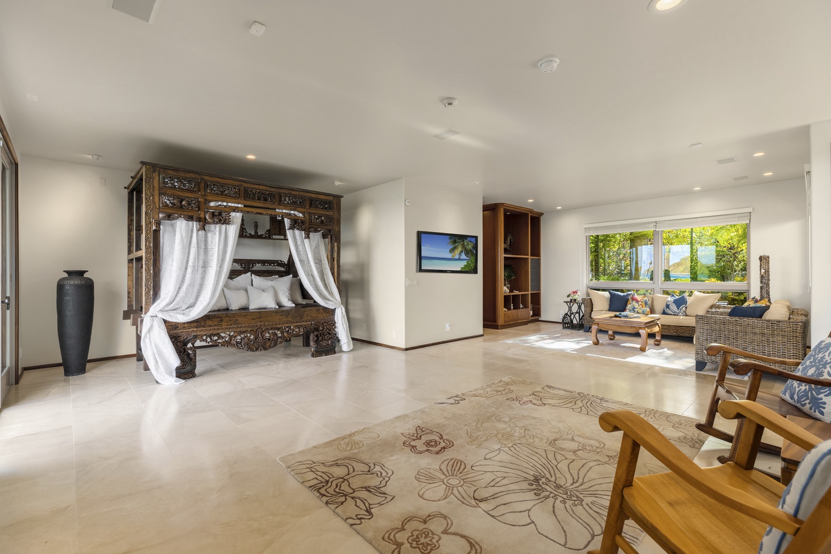 Kailua Vacation Rentals, Mokulua Sunrise - The Primary Bedroom is furnished with an Olympic queen bed, access to the ocean front lanai, walk-in closet, and ensuite bath