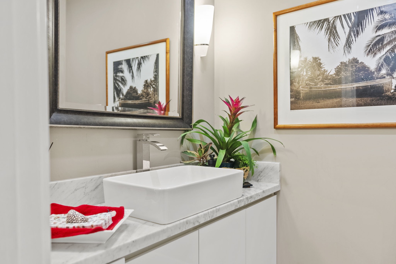 Honolulu Vacation Rentals, Pili Pono - Powder room with sleek vanity and stylish decor.