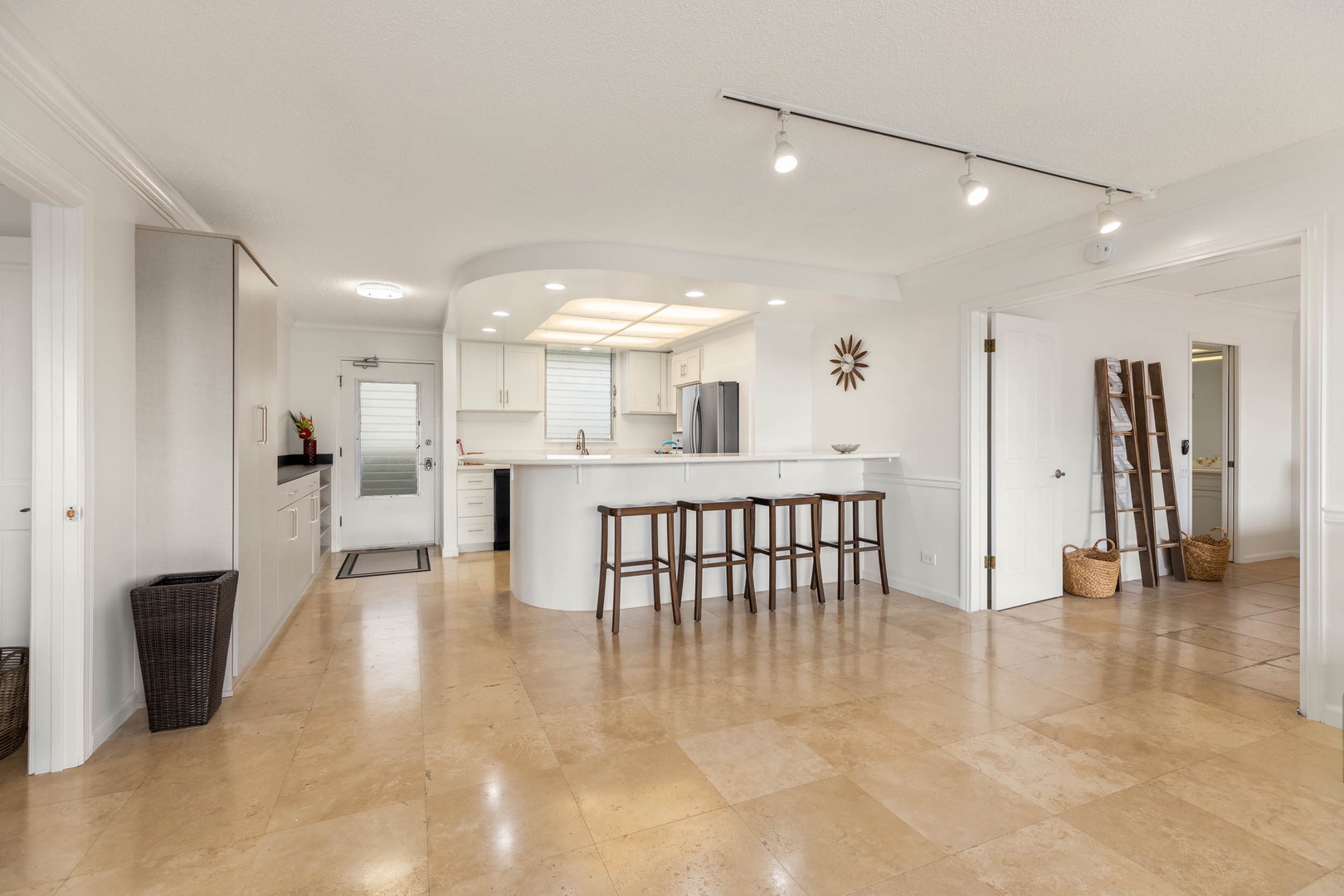 Honolulu Vacation Rentals, Colony Surf Getaway - Modern and spacious kitchen with bar seating – perfect for casual dining or morning coffee in comfort.