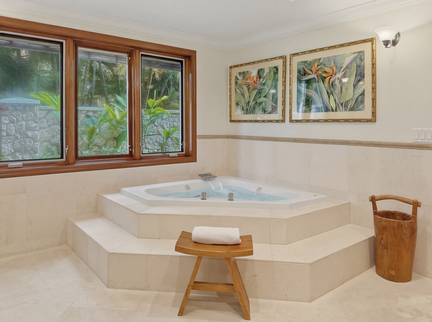 Honolulu Vacation Rentals, Maunalua Estate - Unwind in your private spa-like sanctuary with a luxurious corner jetted tub and tropical garden views through beautiful wood-framed windows.