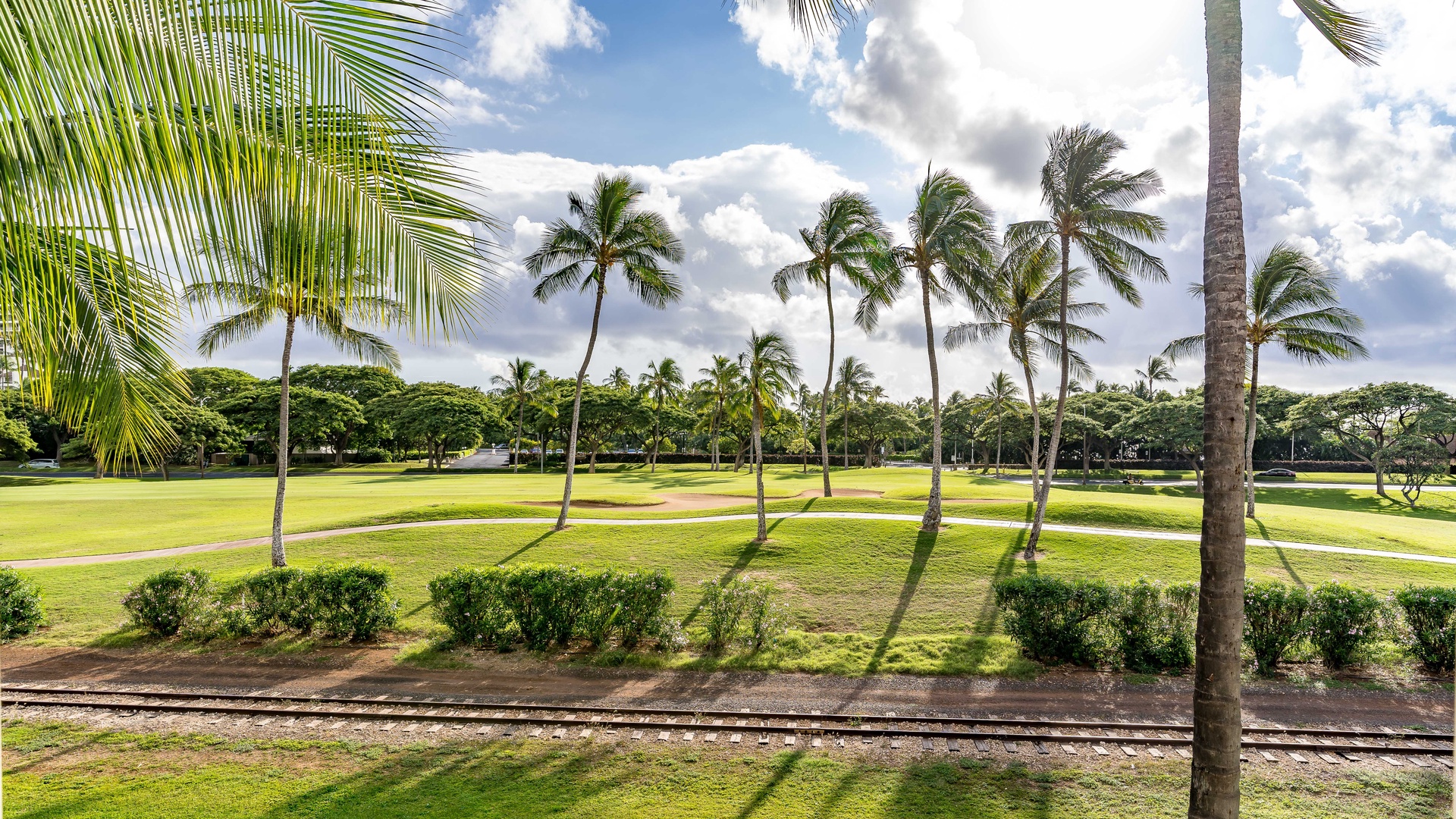 Kapolei Vacation Rentals, Coconut Plantation 1086-4 - Lush greenery and manicured lawns surrounding the condo.