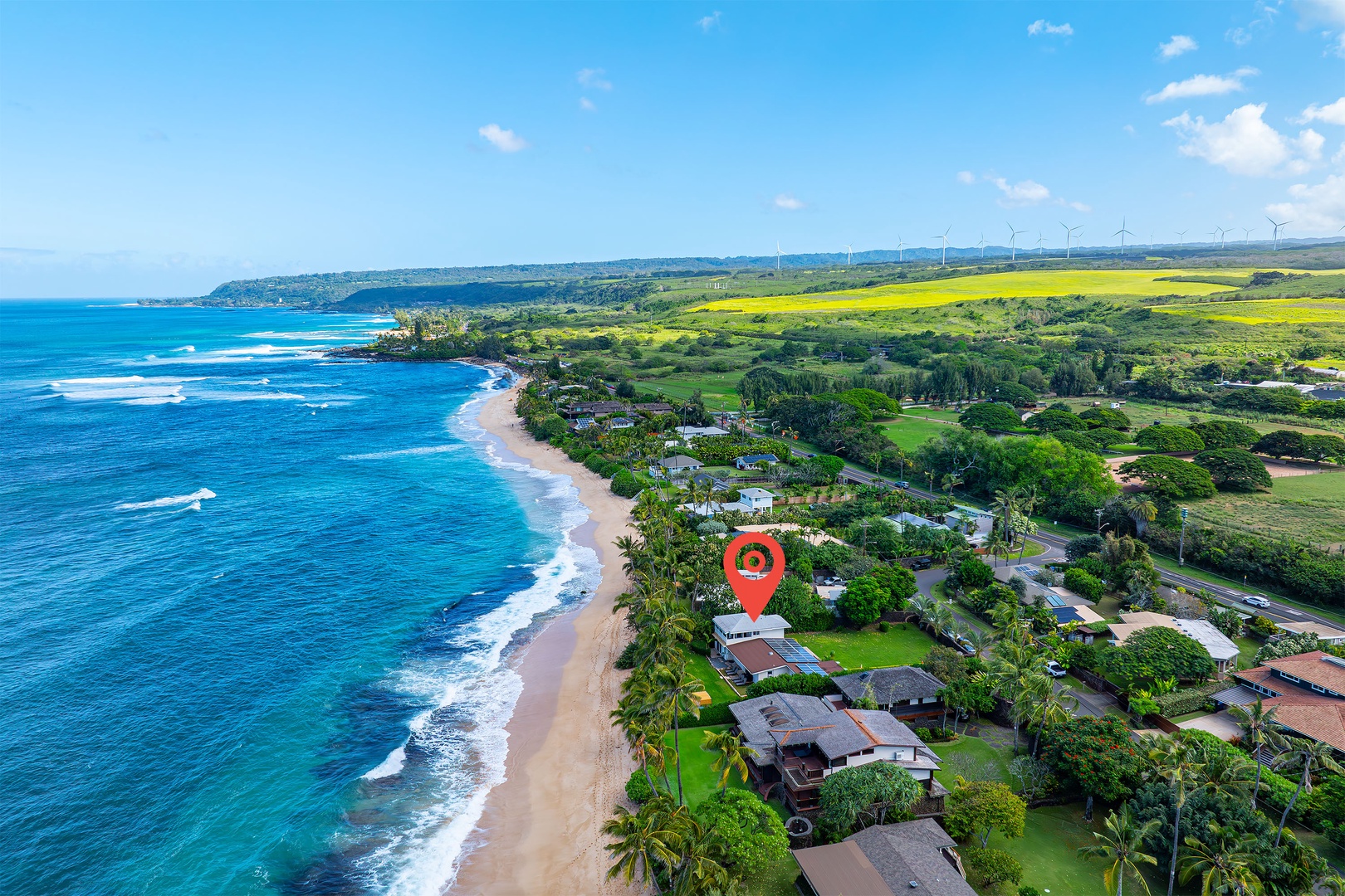 Haleiwa Vacation Rentals, North Shore Beachfront Resort - Aerial of beachfront homes and turquoise waters.