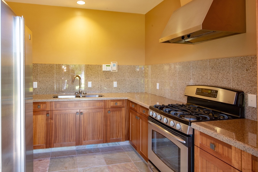 Kamuela Vacation Rentals, 6BD Mauna Lani Lux Golf Estate (5) at One Ocean - The Ocean Club Kitchen with a gas range