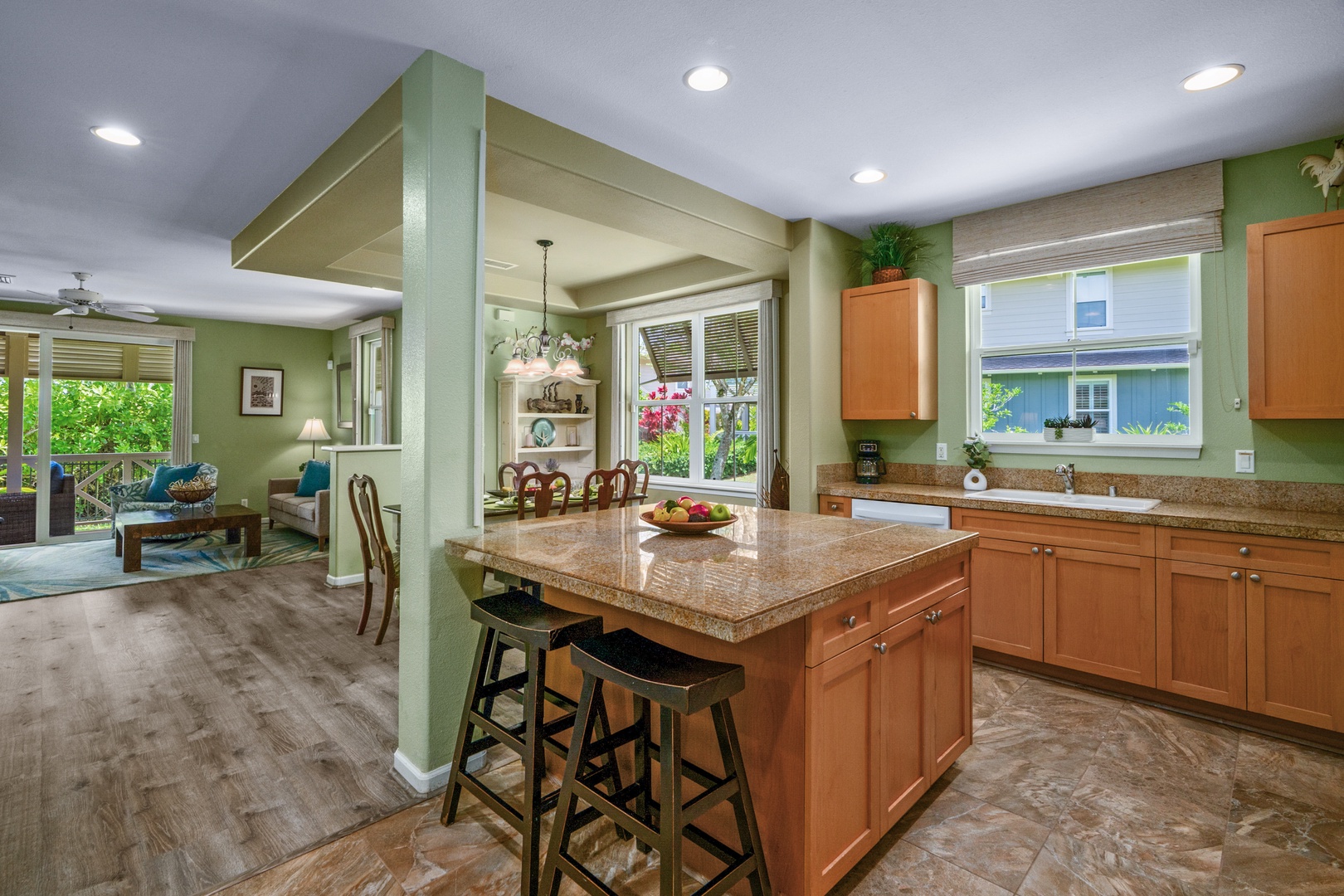 Princeville Vacation Rentals, Kaimana Villa - Your spacious kitchen island becomes the heart of your home, where morning coffee and evening conversations naturally gather in this beautifully appointed space.