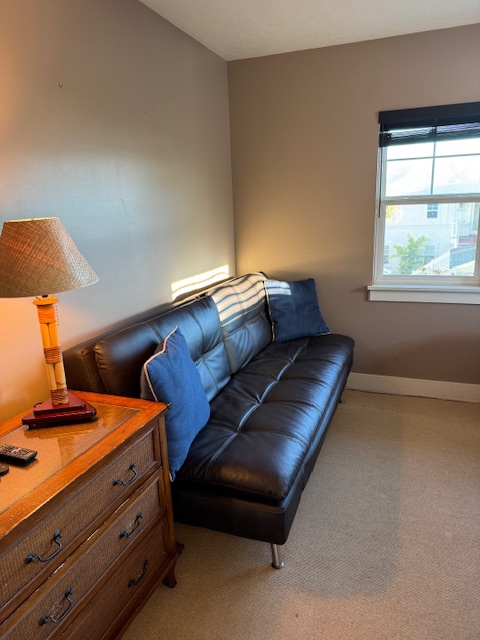 Princeville Vacation Rentals, Pili Aloha - Cozy den with a comfortable leather futon and natural light from a window.