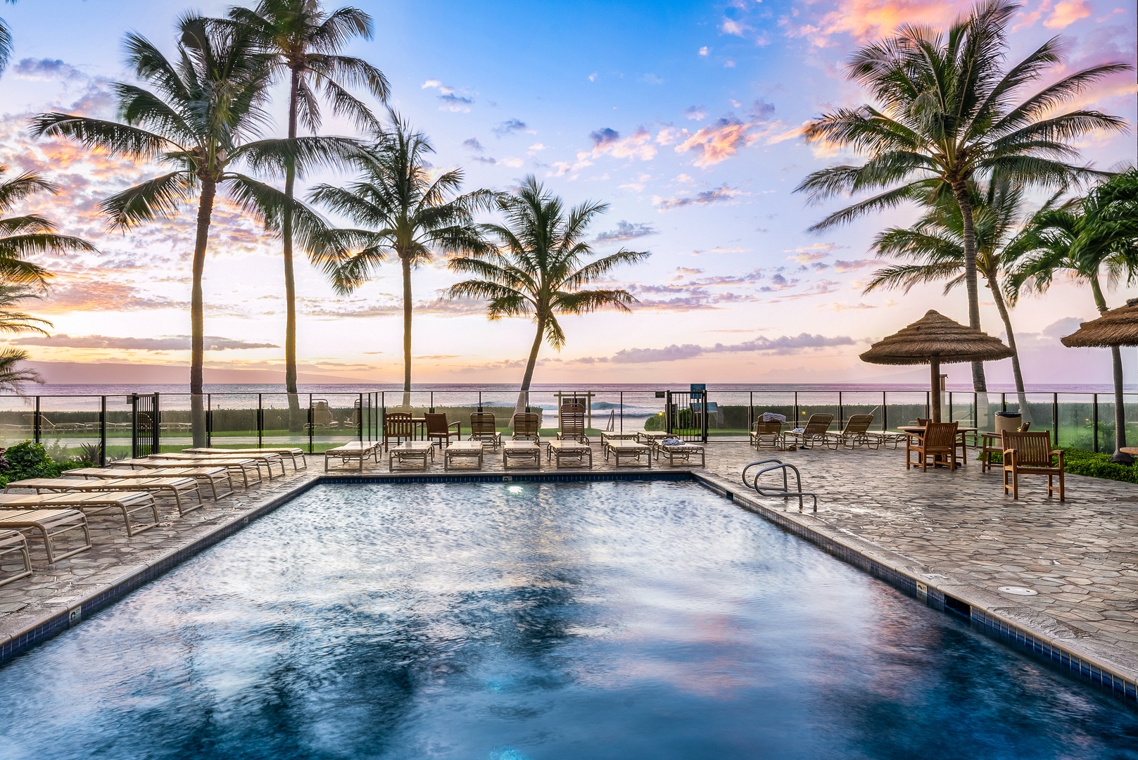 Lahaina Vacation Rentals, Mahana 1119 - Evenings glow at Mahana 1119 with cotton candy sunsets reflecting over the oceanfront pool.