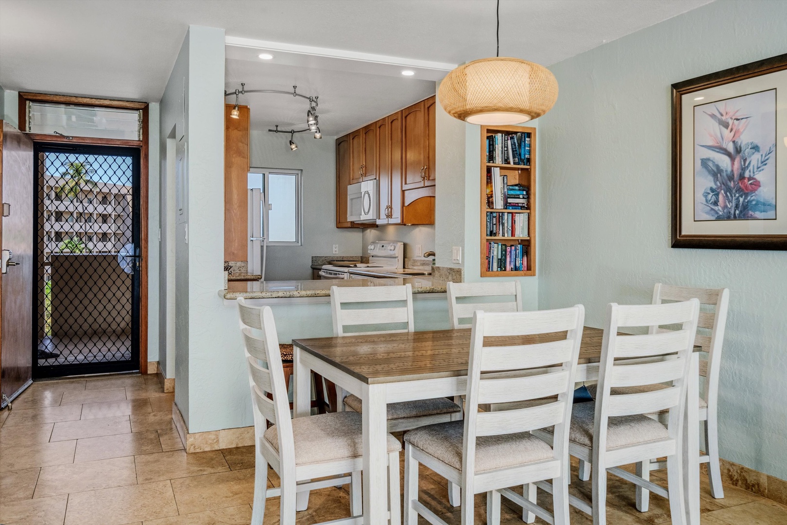 Kihei Vacation Rentals, Menehune Shores 420 - Prep in a kitchen that opens right onto the table, conversation and all.