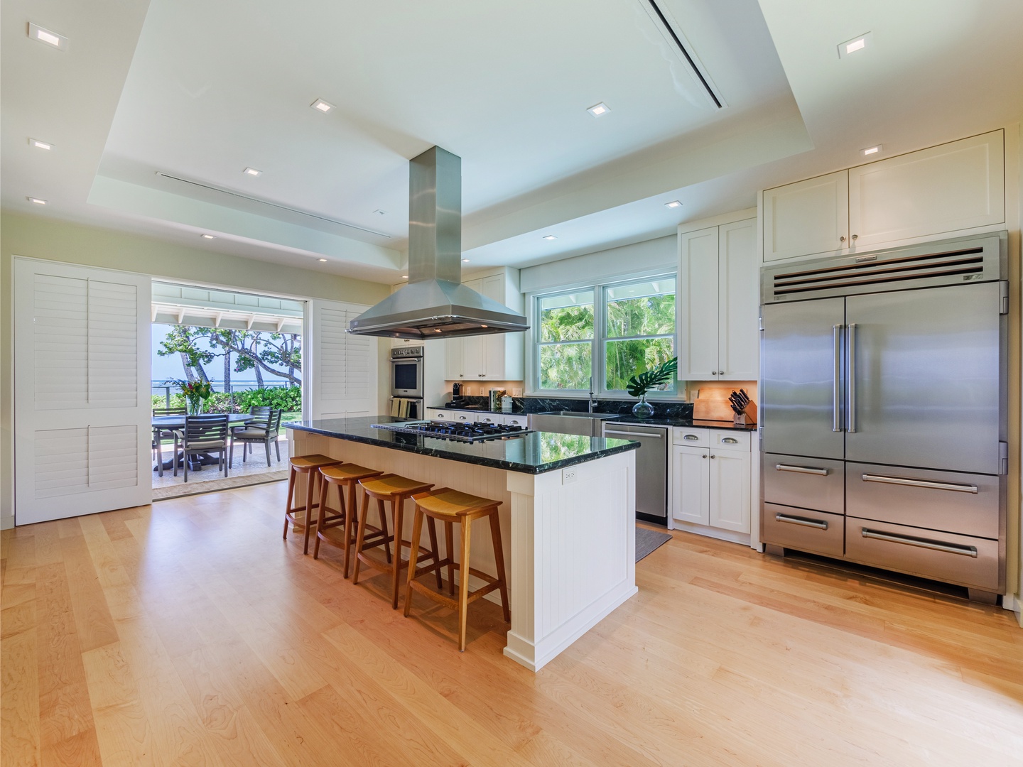 Honolulu Vacation Rentals, Paradise Beach Estate - Dive into culinary adventures in our spacious kitchen area, where ample space meets modern functionality for all your cooking endeavors.