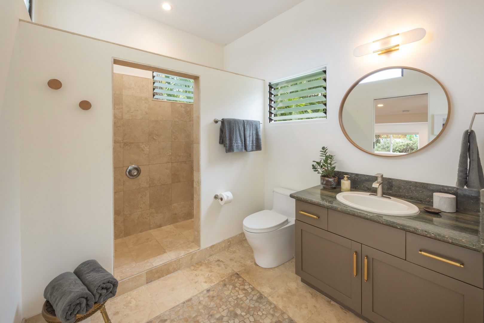 Kailua Vacation Rentals, Lanikai Ola Nani - The private bath for Bedroom Four includes a sleek walk-in shower and floating vanity—combining style and privacy.