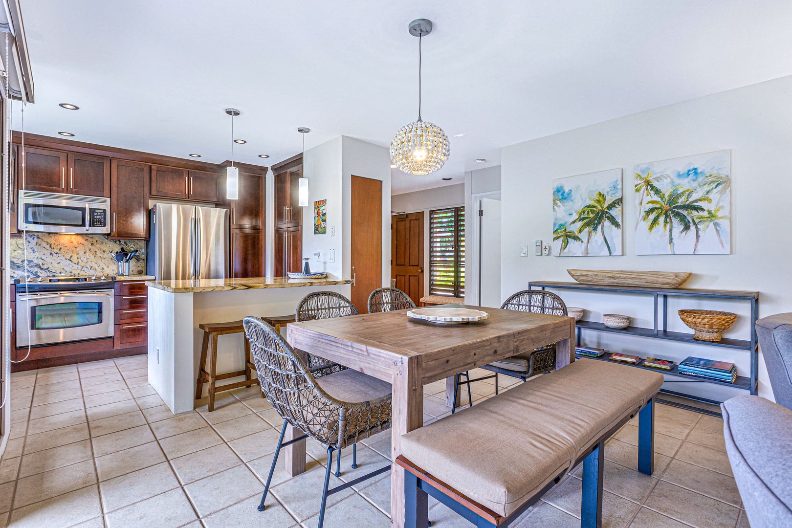 Kihei Vacation Rentals, Wailea Ekolu 1605 - The spacious dining area features a large table with bench seating, ideal for gathering with family or friends for meals or game nights.