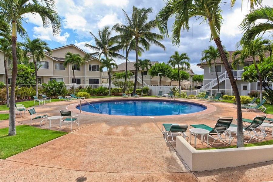 Kapolei Vacation Rentals, Fairways at Ko Olina 7A - Relax by the sparkling pool surrounded by swaying palms and comfortable loungers in your tropical paradise getaway.