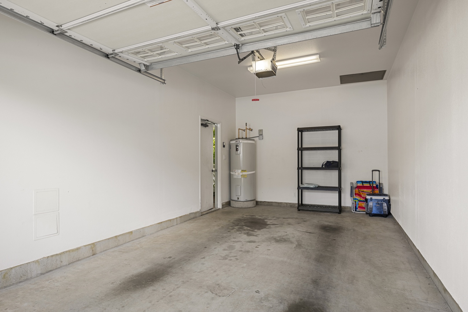The attached garage provides convenient parking and additional space for beach gear and vacation essentials.