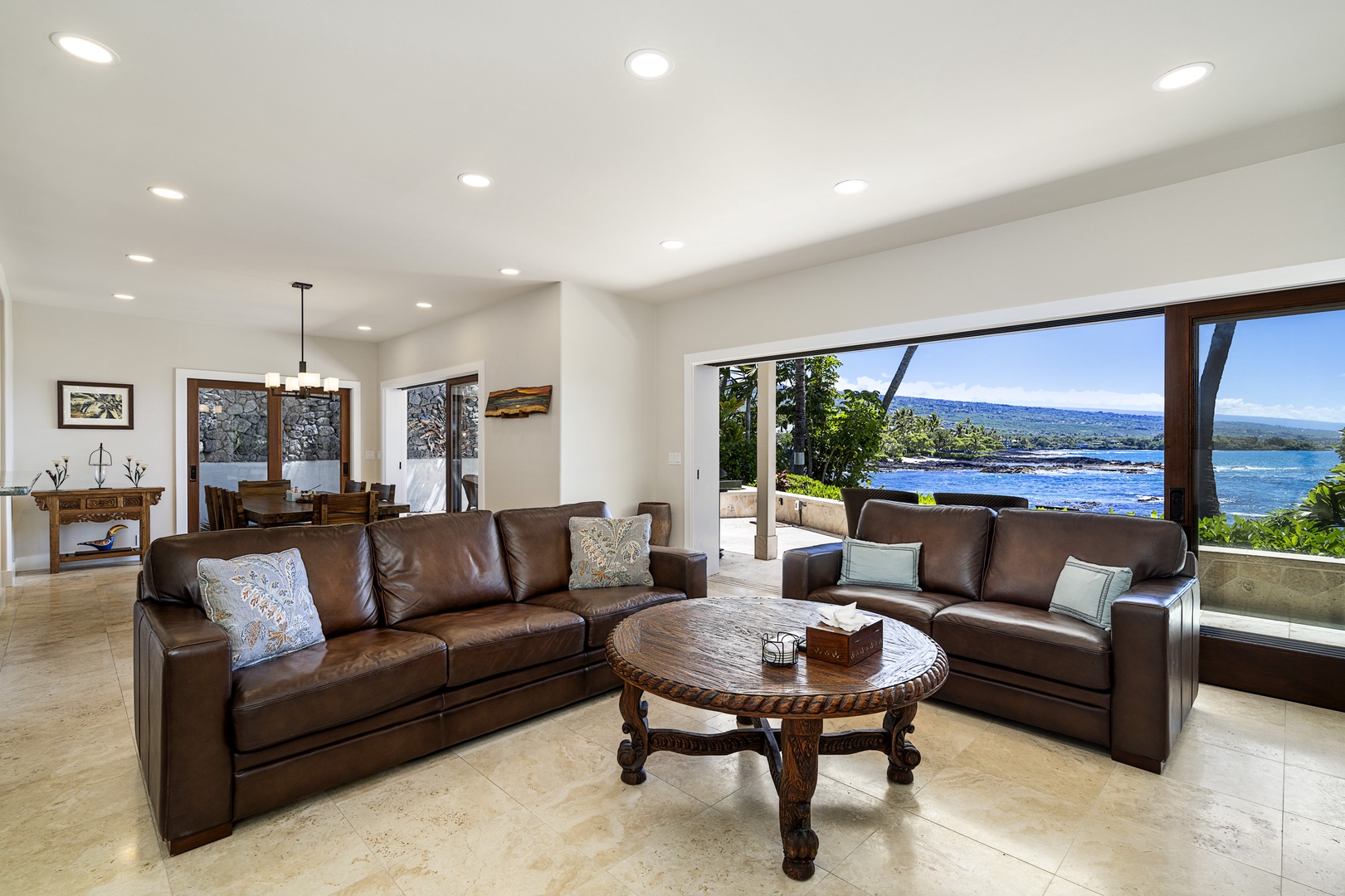 Kailua Kona Vacation Rentals, Ali'i Point #7 - As you enter this multi-level house, you will be greeted by an expansive and spacious living room area that boasts oversized leather comfy sofas, a large HD TV, and sliding doors that open to the lanai and ocean beyond
