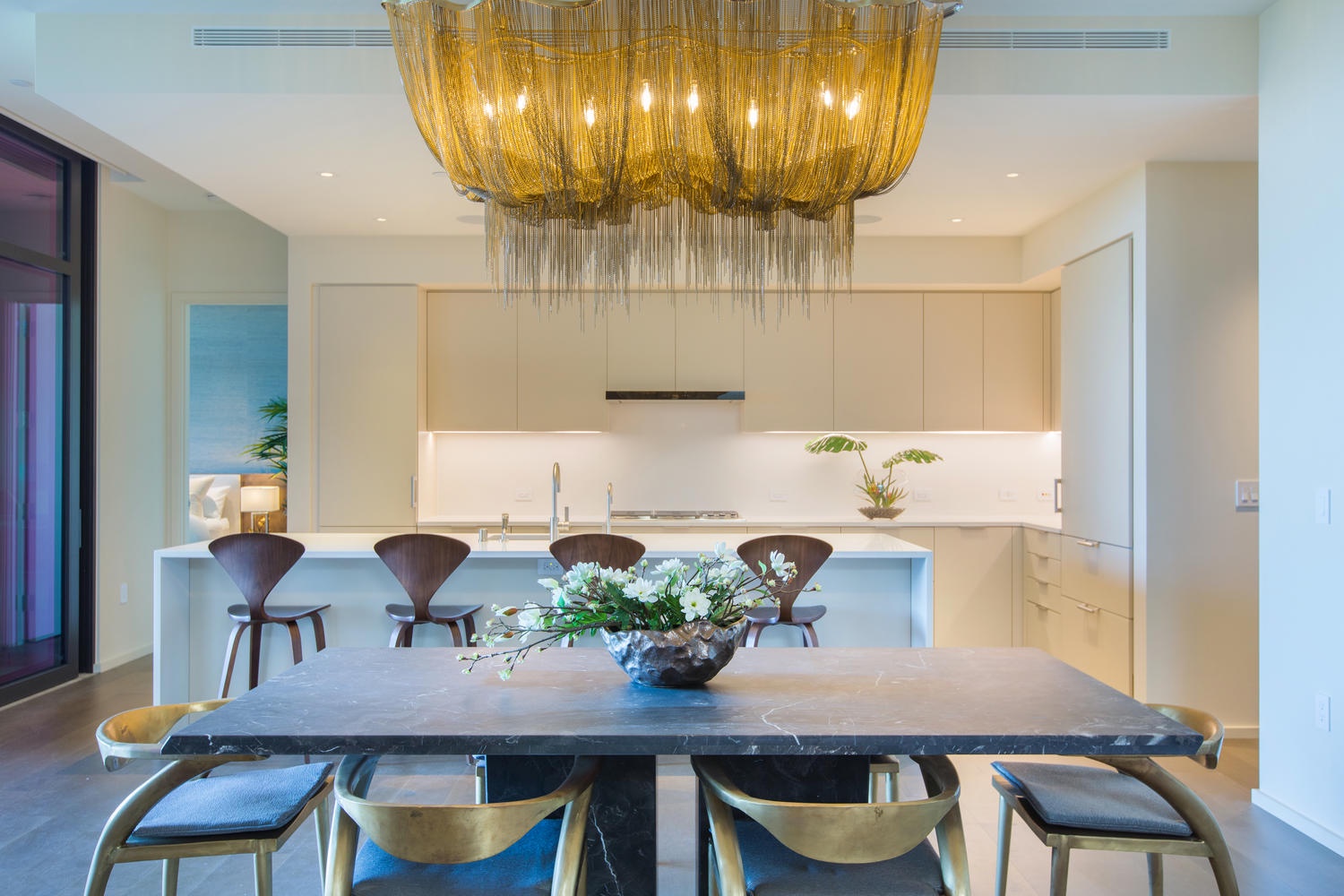 Honolulu Vacation Rentals, Park Lane Sunset Resort - Your elegant dining space features a stunning chandelier and sleek kitchen, perfect for memorable meals together.