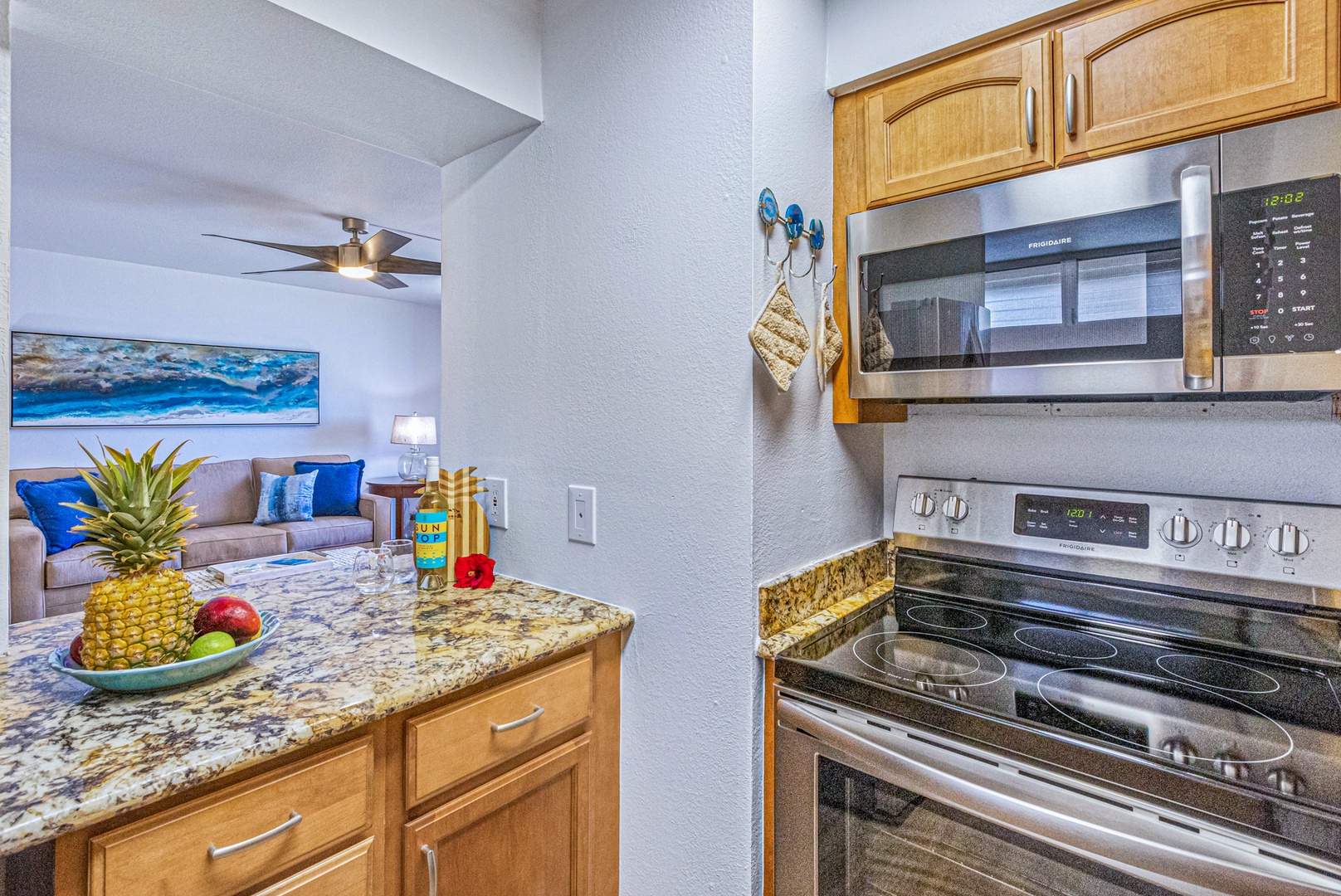 Lahaina Vacation Rentals, Royal Kahana 213 - Modern kitchen with stainless steel appliances and a view into the living area, making it easy to cook while staying connected with family and friends.