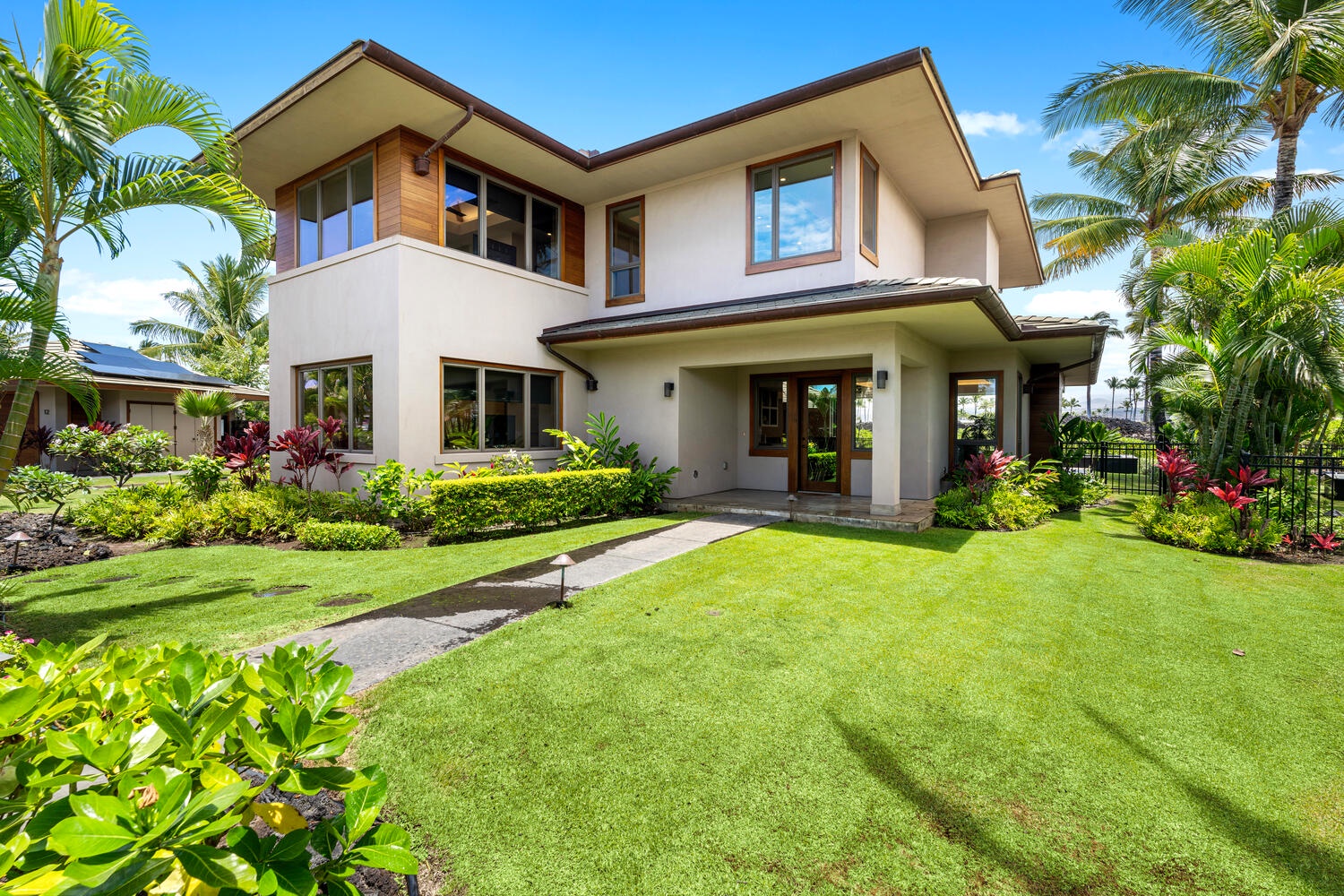 Kamuela Vacation Rentals, Laule'a at the Mauna Lani Resort #14 - Expansive backyard with manicured lawn and tropical gardens for families to enjoy.