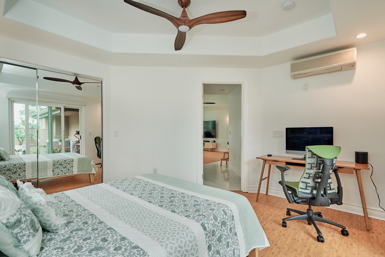 Princeville Vacation Rentals, Hale Kai - Your serene bedroom features a comfortable bed, dedicated workspace, and modern amenities to make your stay productive and restful.